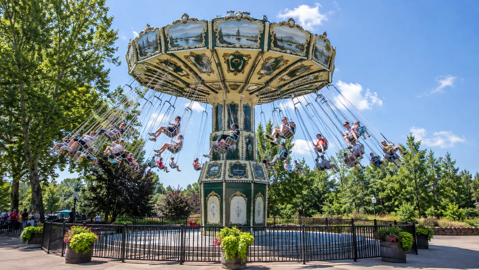 Guests swinging among the trees on the Wave Swinger